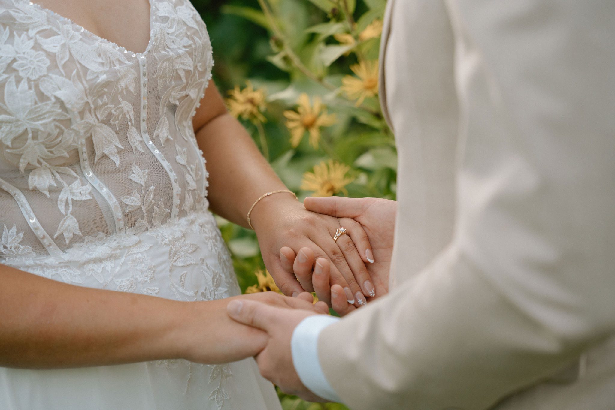 bride and groom holding hands