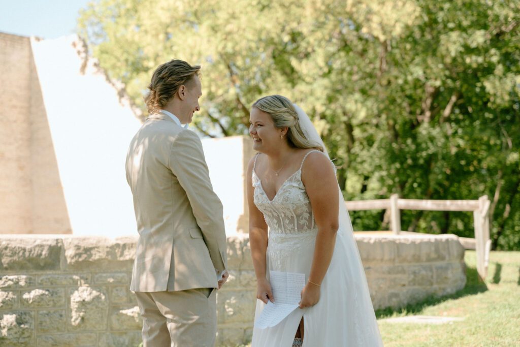 Bride laughing during personal intimate vows