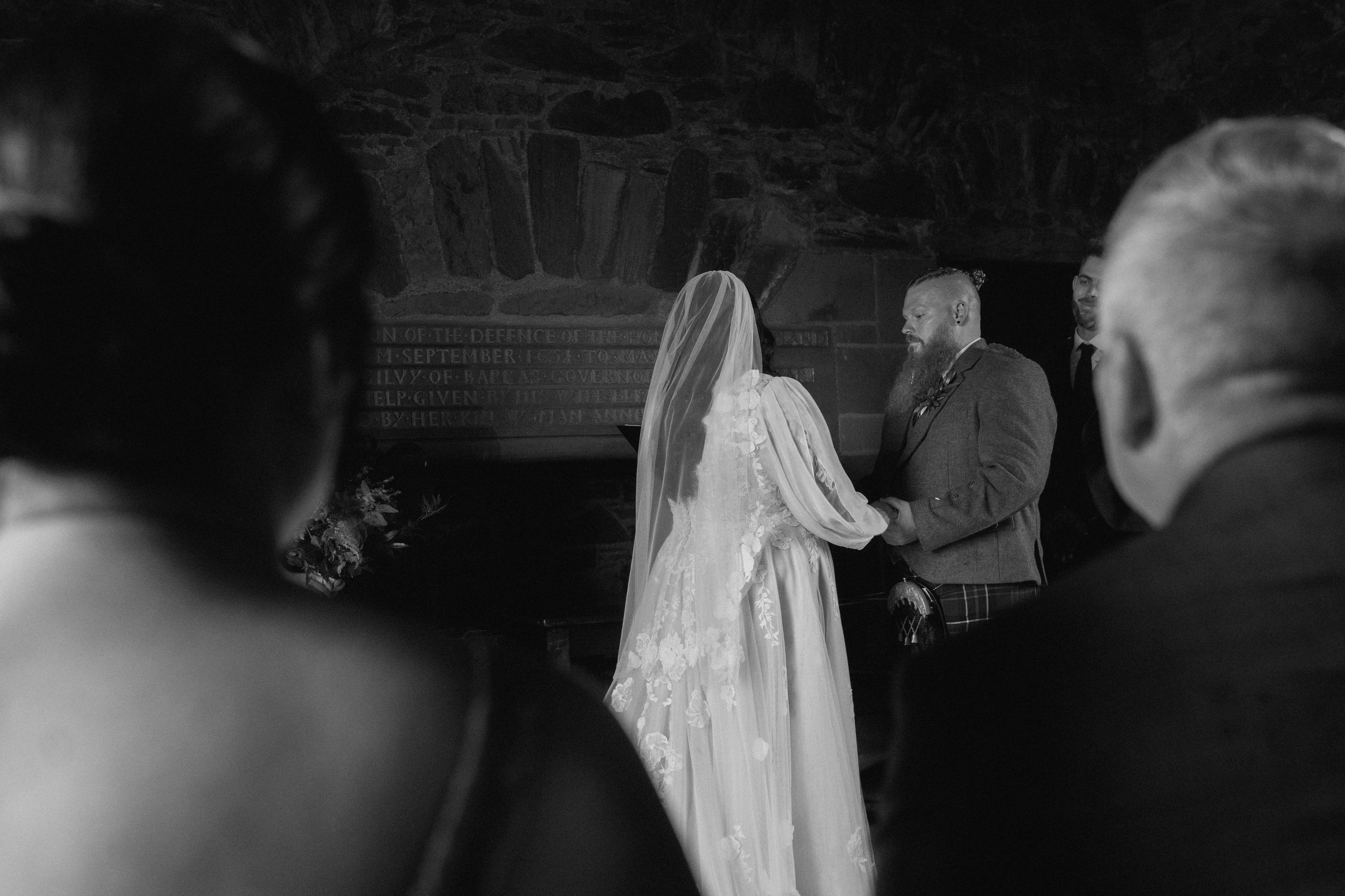 documentary style wedding photography capturing wedding vows at Scotland castle ceremony