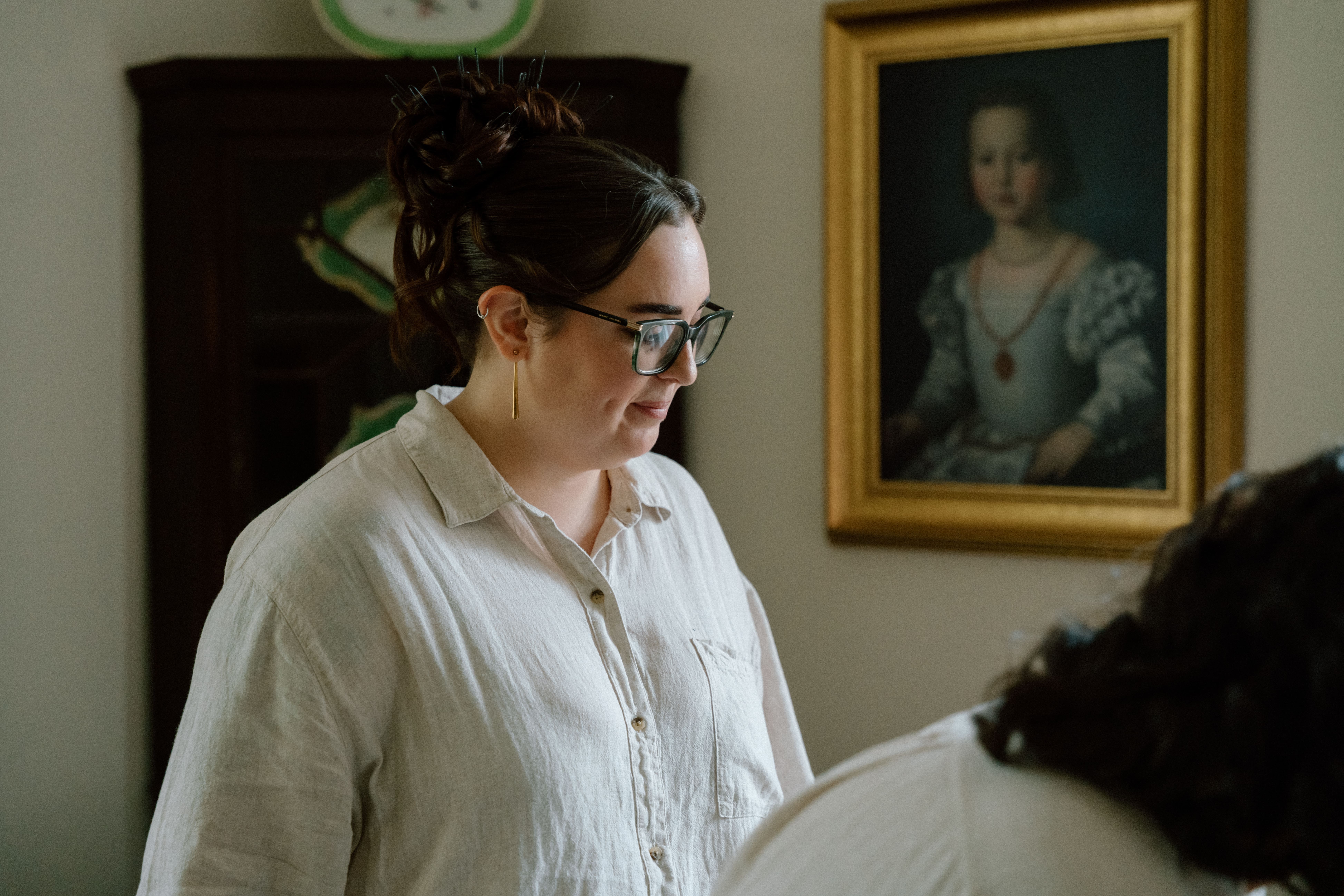 Documentary wedding photography capturing quiet bridal preparation moments with natural light and authentic emotion at Elsick House in Scotland.