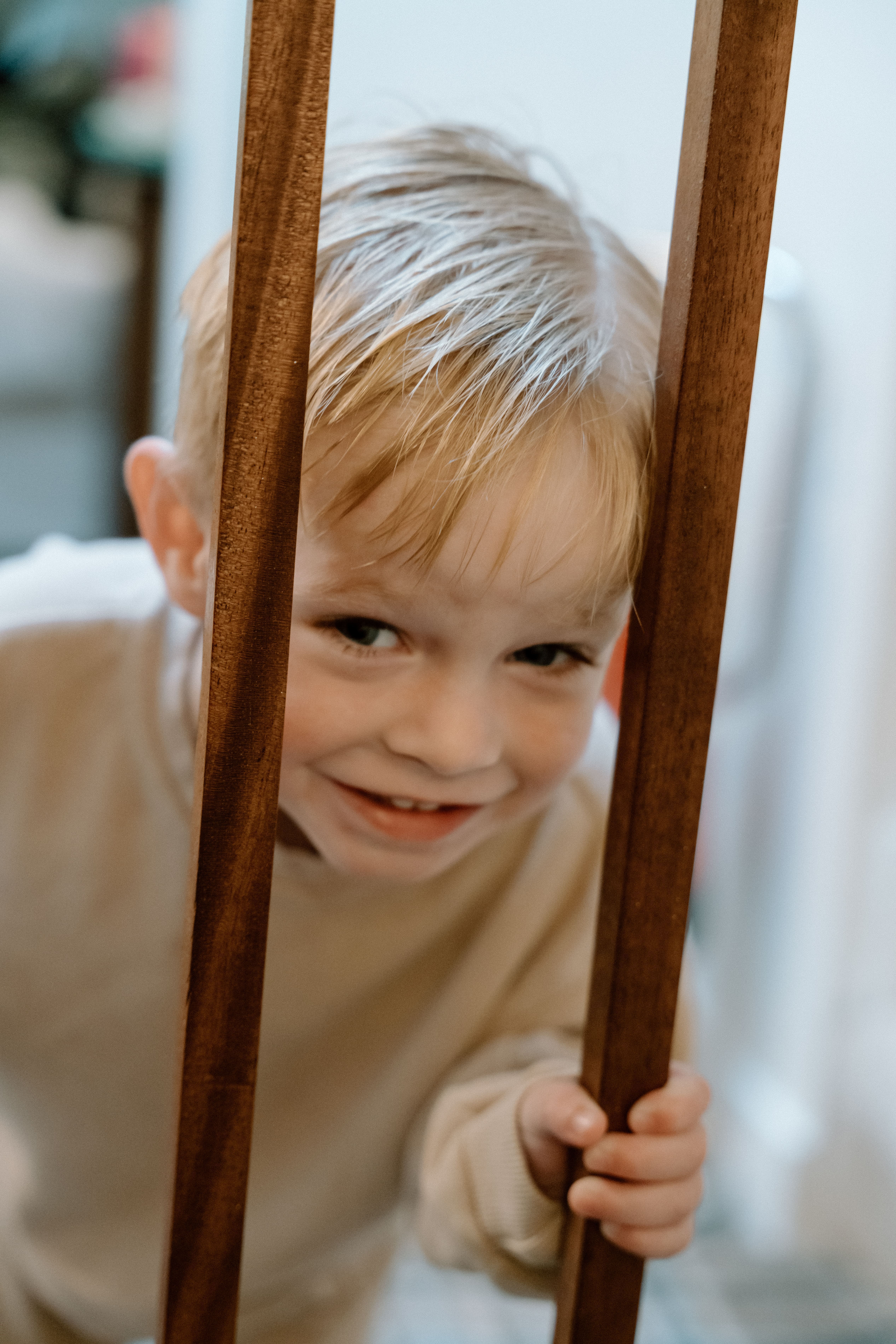 Candid documentary photo of a child playing happily during the getting ready portion of the wedding day at Elsick House.
