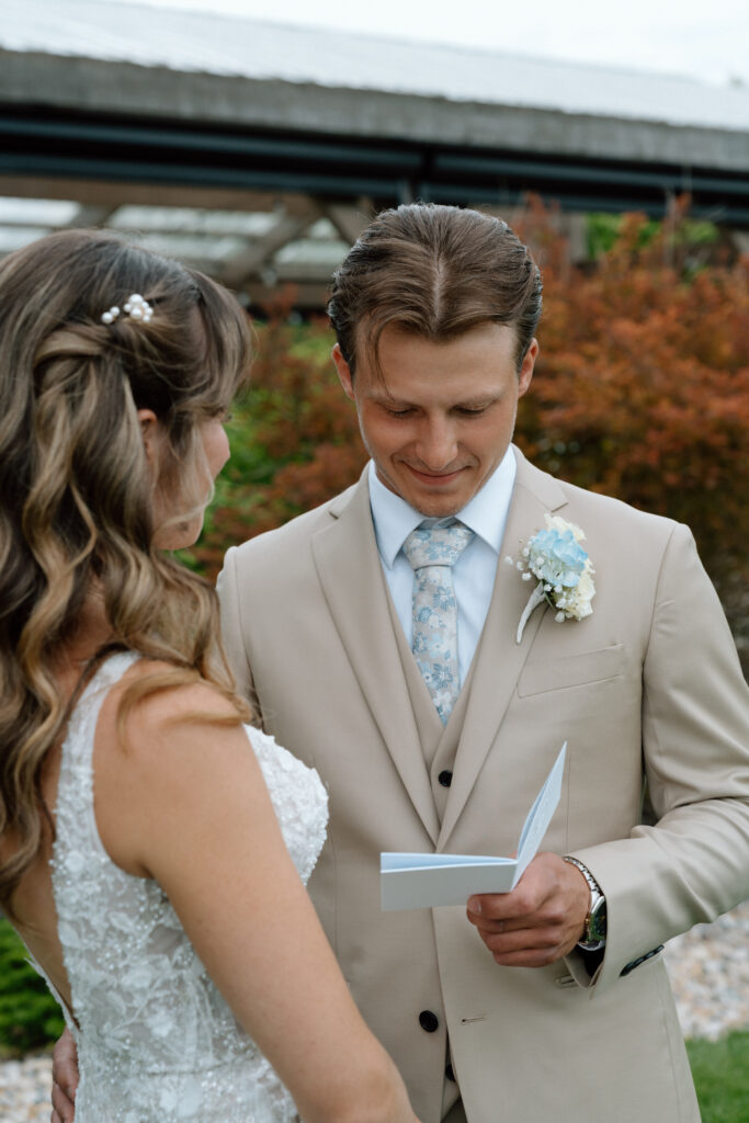 Bride and groom enjoying a candid moment together during their Hawthorne Estates wedding