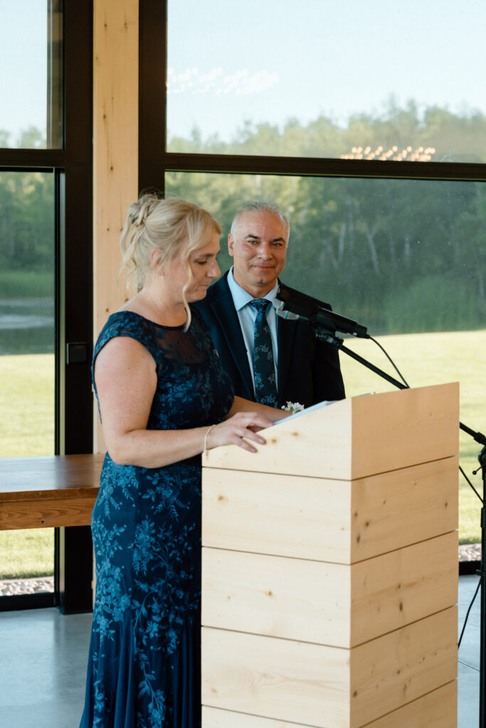 Julianna's parents giving a speech during the wedding reception at The White Poplar in Manitoba