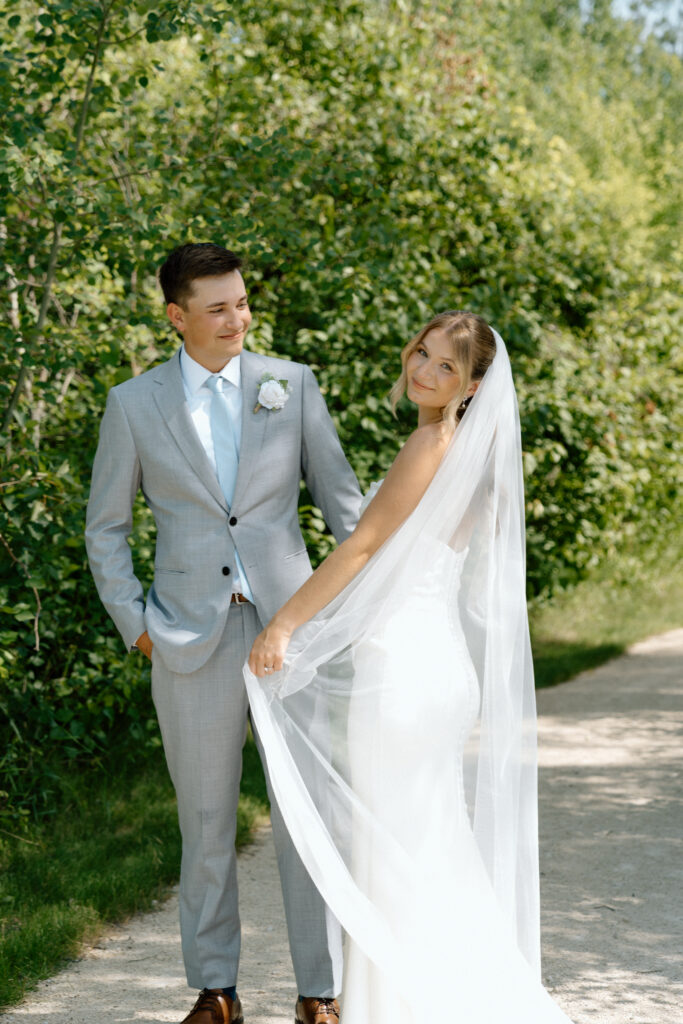 Julianna and Cole in a clean, editorial wedding portrait along the grounds of The White Poplar