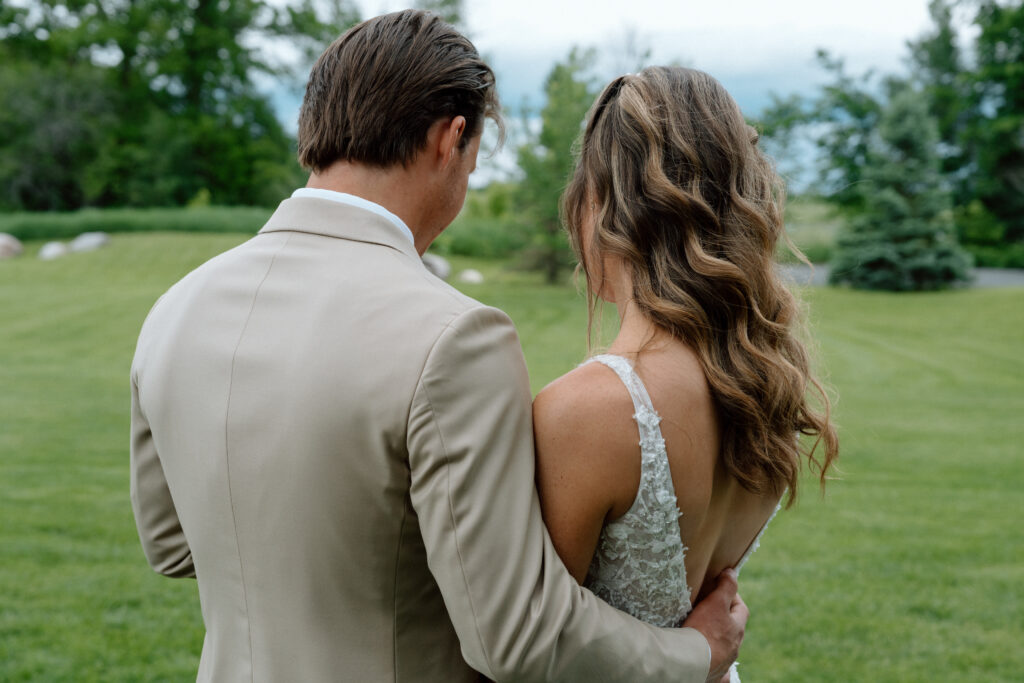 Kayla and Myles embracing during their first look at Hawthorne Estates wedding venue