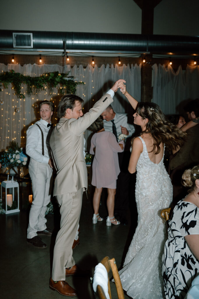 Myles twirling Kayla during their first dance at Hawthorne Estates in Manitoba